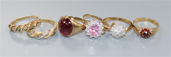 Five 9ct gold rings and one 10ct ring, including a gentlemans cabochon garnet set-ring,